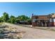 Charming townhome with carport parking, brick accents, and well-maintained landscaping at 2700 S Holly St # 115, Denver, CO 80222