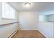 Cozy room with a window, carpeted floor, and a clean, neutral color scheme at 2700 S Holly St # 115, Denver, CO 80222
