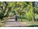 Scenic walking path surrounded by lush trees, perfect for a relaxing stroll at 2700 S Holly St # 115, Denver, CO 80222