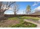 Expansive backyard featuring a partially fenced yard with lush greenery and potential for outdoor enjoyment at 5123 Milwaukee St, Denver, CO 80216