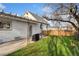 Beautiful backyard with covered patio, perfect for outdoor dining and entertaining at 5123 Milwaukee St, Denver, CO 80216