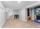 Finished basement space with carpet, neutral paint, recessed lighting, and storage shelves at 5123 Milwaukee St, Denver, CO 80216