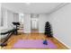 Basement gym with hard wood floors and weight training equipment at 5123 Milwaukee St, Denver, CO 80216