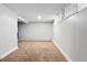 Finished basement area with carpet and wood-paneled walls, great for additional living space at 5123 Milwaukee St, Denver, CO 80216