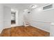 Spacious basement area with hardwood floors and stairs at 5123 Milwaukee St, Denver, CO 80216
