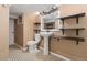 Basement bathroom features a pedestal sink, stylish mirror, and convenient shelving for storage solutions at 5123 Milwaukee St, Denver, CO 80216