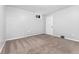 Bright bedroom with neutral carpet, white trim, and a window that lets in natural light at 5123 Milwaukee St, Denver, CO 80216