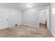 Bedroom with carpet, a closet, and a door leading to the bathroom at 5123 Milwaukee St, Denver, CO 80216