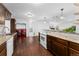 Charming kitchen with granite countertops, stainless steel appliances, and dark wood cabinets at 5123 Milwaukee St, Denver, CO 80216