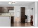 Charming kitchen featuring dark wood cabinets, granite countertops, and stainless steel appliances at 5123 Milwaukee St, Denver, CO 80216