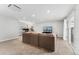 Spacious living room with neutral carpeting, large modular couch, and an abundance of natural light at 5123 Milwaukee St, Denver, CO 80216