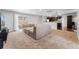 Spacious living room featuring carpet, open concept kitchen, and sliding glass doors to the yard at 5123 Milwaukee St, Denver, CO 80216