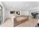 Open-concept living room with comfortable seating and a view into the kitchen at 5123 Milwaukee St, Denver, CO 80216