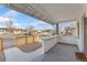 Inviting front porch with a concrete floor and a partial privacy wall, perfect for relaxing outdoors at 5123 Milwaukee St, Denver, CO 80216
