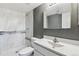 Modern bathroom featuring tiled shower, vanity, and updated fixtures at 19192 E Wyoming Pl # 206, Aurora, CO 80017