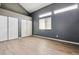 Bright bedroom with vaulted ceilings, ample closet space, and stylish flooring at 19192 E Wyoming Pl # 206, Aurora, CO 80017