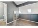 Open bedroom with lofted ceilings and wood-style flooring at 19192 E Wyoming Pl # 206, Aurora, CO 80017