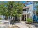 Charming condo with trees and a nice walkway leading to the front door at 19192 E Wyoming Pl # 206, Aurora, CO 80017