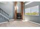 Cozy living room with a decorative brick fireplace and ample natural light at 19192 E Wyoming Pl # 206, Aurora, CO 80017