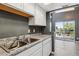 Updated kitchen area adjacent to the living room and featuring modern finishes at 19192 E Wyoming Pl # 206, Aurora, CO 80017