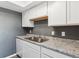 Beautiful kitchen featuring white cabinets and modern countertops at 19192 E Wyoming Pl # 206, Aurora, CO 80017