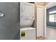 Efficient laundry area features a stacked washer and dryer for space-saving convenience at 19192 E Wyoming Pl # 206, Aurora, CO 80017