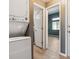 Efficient laundry area features a stacked washer and dryer for space-saving convenience at 19192 E Wyoming Pl # 206, Aurora, CO 80017