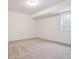 Spacious unfinished basement room with neutral carpeting and large window at 3826 N Elk St, Aurora, CO 80019