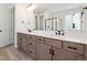 Modern bathroom boasts double vanity, quartz countertop, and black fixtures at 3826 N Elk St, Aurora, CO 80019