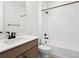 Clean bathroom featuring a bathtub, shower, and modern vanity at 3826 N Elk St, Aurora, CO 80019