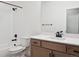 Modern bathroom with a vanity, toilet, shower, and bathtub at 3826 N Elk St, Aurora, CO 80019