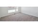 Bright bedroom with neutral carpeting and large window at 3826 N Elk St, Aurora, CO 80019
