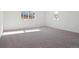Bright bedroom with neutral carpeting and large windows at 3826 N Elk St, Aurora, CO 80019