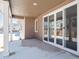 Covered patio with sliding glass doors leading to backyard at 3826 N Elk St, Aurora, CO 80019