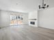 Open living room with hardwood floors, fireplace, and sliding glass doors at 3826 N Elk St, Aurora, CO 80019