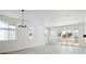 Spacious living room with hardwood floors, sliding glass doors, and a chandelier at 3826 N Elk St, Aurora, CO 80019