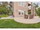 Charming patio with string lights, dining table, and chairs, perfect for outdoor entertaining at 4965 Huntwick Pl, Highlands Ranch, CO 80130