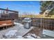 Backyard area featuring stainless steel grill and wood fence, perfect for outdoor cooking and entertaining at 2067 E Phillips Pl, Centennial, CO 80122