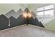 Stylish bedroom with mountain mural, neutral carpet, and a modern industrial lamp at 2067 E Phillips Pl, Centennial, CO 80122