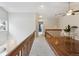 Upstairs hallway featuring a built-in desk area and natural light from the surrounding windows at 2067 E Phillips Pl, Centennial, CO 80122