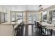 Open kitchen area featuring a breakfast bar, a dining table, and natural light from the surrounding windows at 2067 E Phillips Pl, Centennial, CO 80122