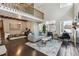 Bright living room with high ceilings, modern decor, and a view of the upper-level loft at 2067 E Phillips Pl, Centennial, CO 80122