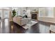 Living room with dark hardwood floors and fireplace at 2067 E Phillips Pl, Centennial, CO 80122