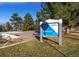 Sign for Abbott Park surrounded by green trees and grass at 2067 E Phillips Pl, Centennial, CO 80122