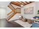 Cozy sitting room with a decorative painting, wood beams, and comfortable seating at 2067 E Phillips Pl, Centennial, CO 80122