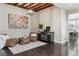 Cozy sitting room with a decorative painting, wood beams, and comfortable seating at 2067 E Phillips Pl, Centennial, CO 80122