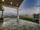Back patio featuring a stamped concrete surface, large posts, and views of the surrounding area at 29780 E 162Nd Ave, Brighton, CO 80603
