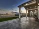 Back patio featuring a stamped concrete surface, large posts, and views of the surrounding area at 29780 E 162Nd Ave, Brighton, CO 80603