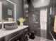 Modern bathroom with a black marble wall and a unique sink at 29780 E 162Nd Ave, Brighton, CO 80603