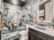A luxurious bathroom featuring unique tilework, glass shower, and modern vanity with a stylish vessel sink at 29780 E 162Nd Ave, Brighton, CO 80603